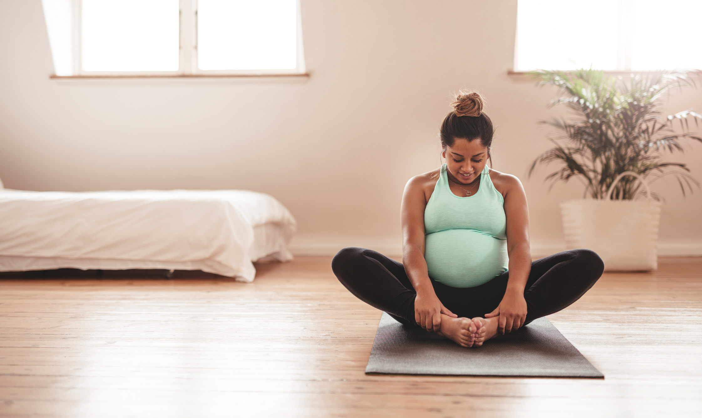 11 Best Pregnancy Stretches To Relieve Aches From A Prenatal Trainer