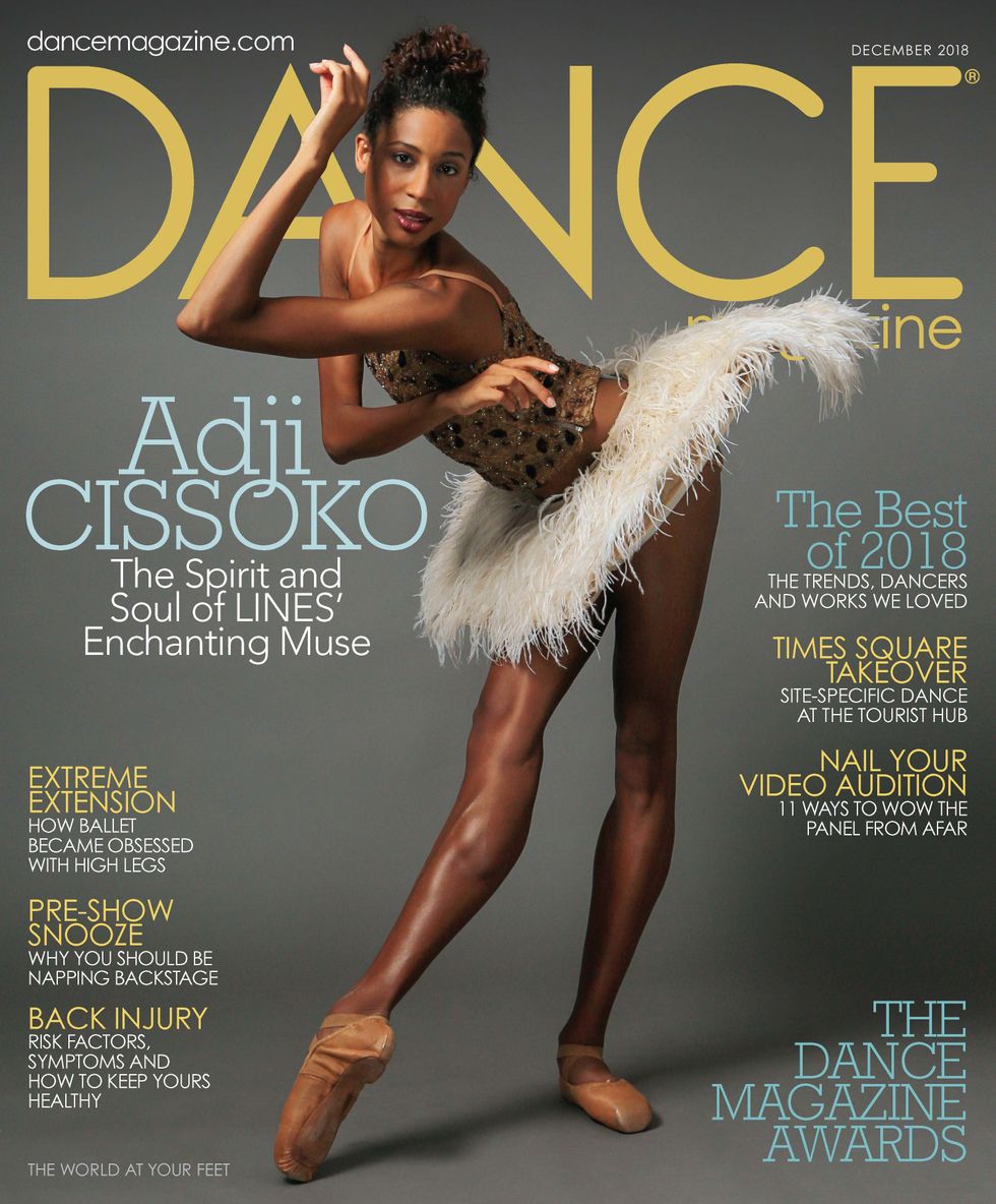 Dance Magazine's December cover featuring dancer Adji Cissoko in pointe shoes and a feather tutu