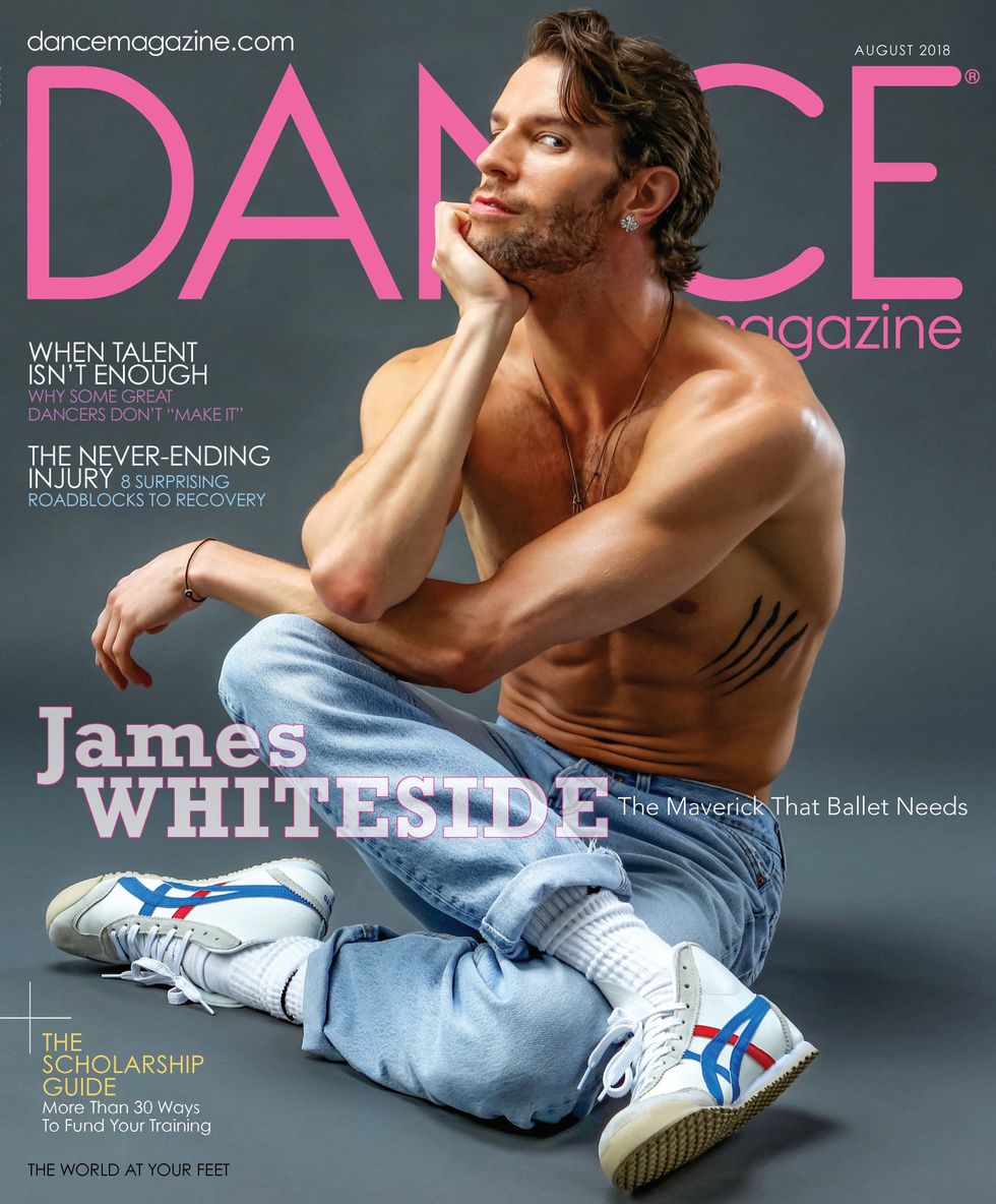 Dance Magazine's August cover featuring a bare-chested James Whiteside in jeans, with a sly side-eyed smirk