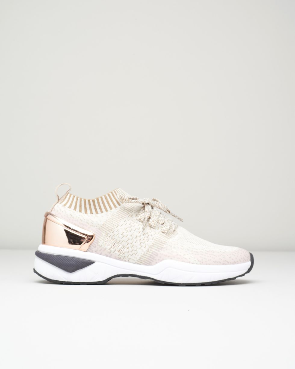 An image of Bloch's Alcyone sneaker in rose gold, with a shiny rose gold heel, white bottom, and tan mesh top.