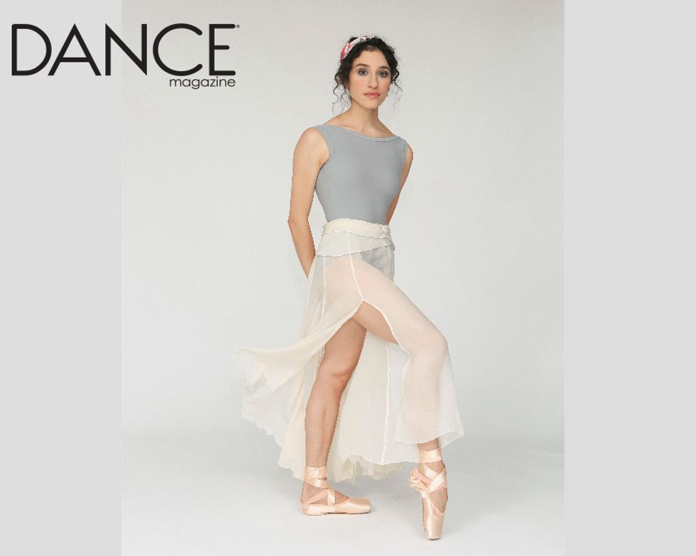 Channeling 1970s Natalia Makarova, Leta Biasucci stands with one foot on pointe, staring enigmatically into the camera 
