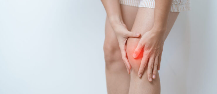 woman having knee ache and muscle pain