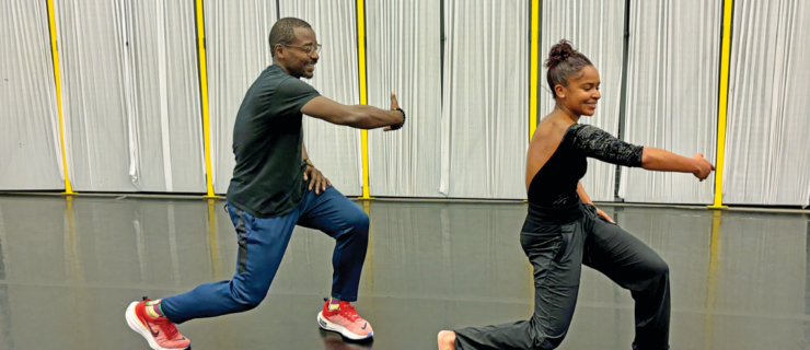 Robert Battle dancing next to Jada Pearman in rehearsal