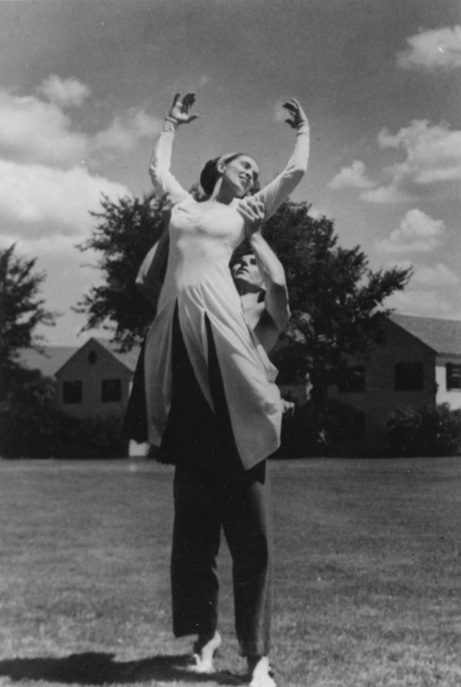 Erick Hawkins lifting Martha Graham in the air while partnering outdoors